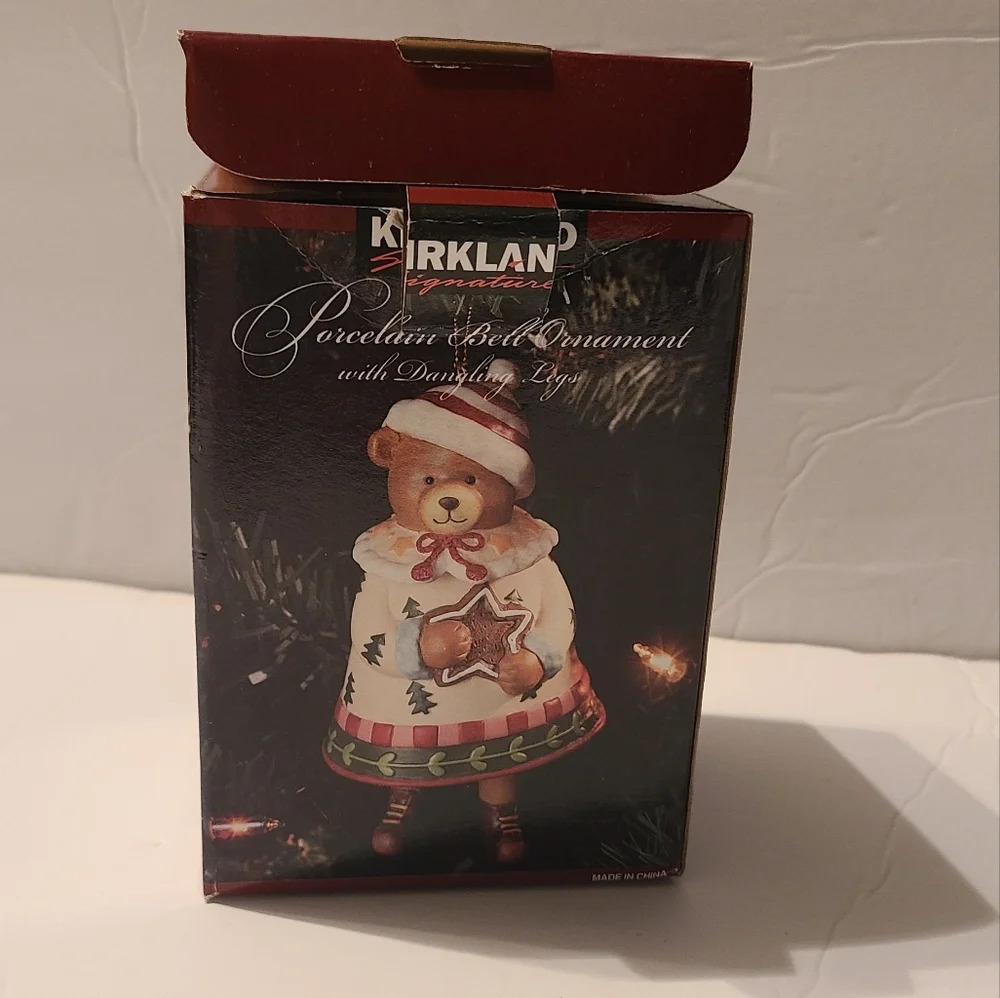 Kirklands porcelain bell ornament with dangling legs